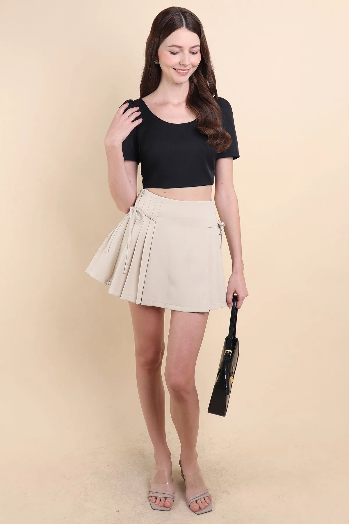 BEBE PADDED BOW OPEN BACK TOP IN BLACK