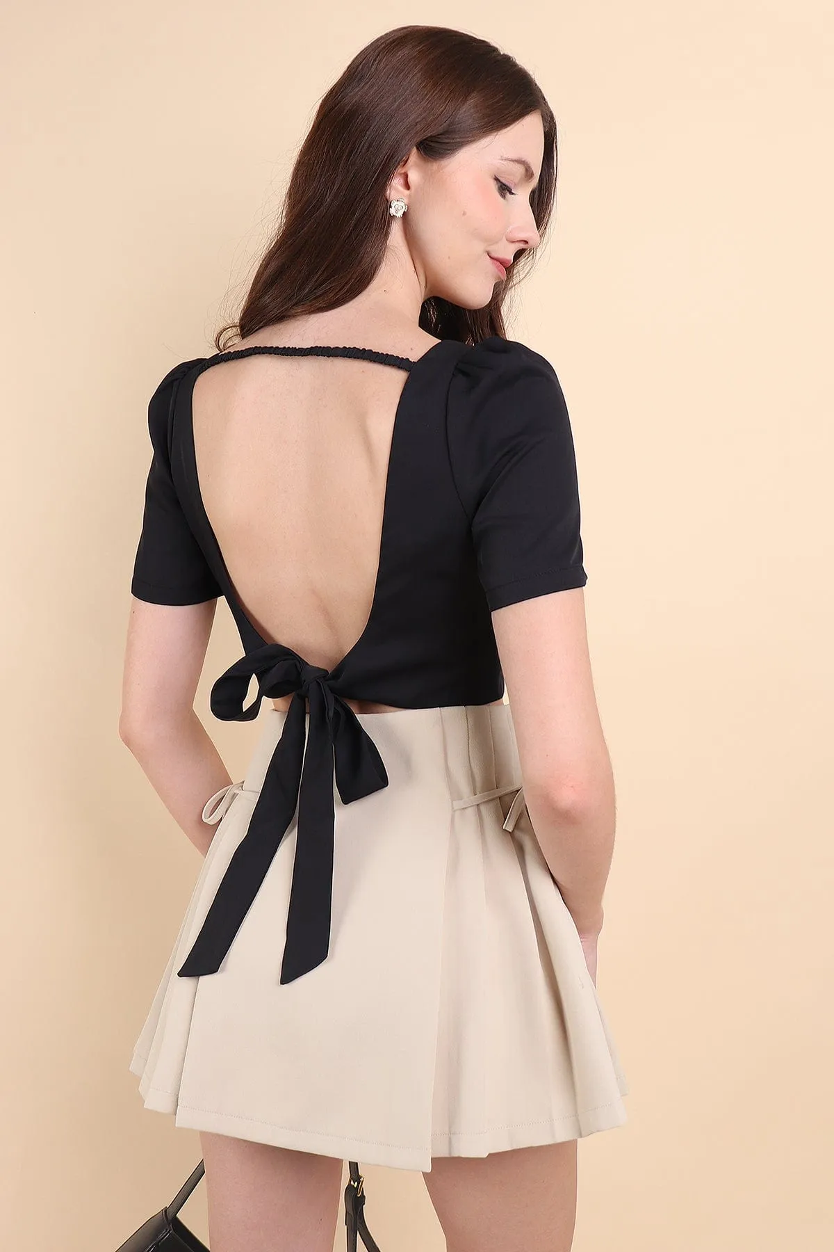 BEBE PADDED BOW OPEN BACK TOP IN BLACK